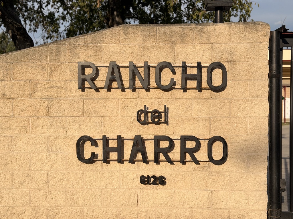 Rancho del Charro sign at the entrance to the San Antonio lienzo